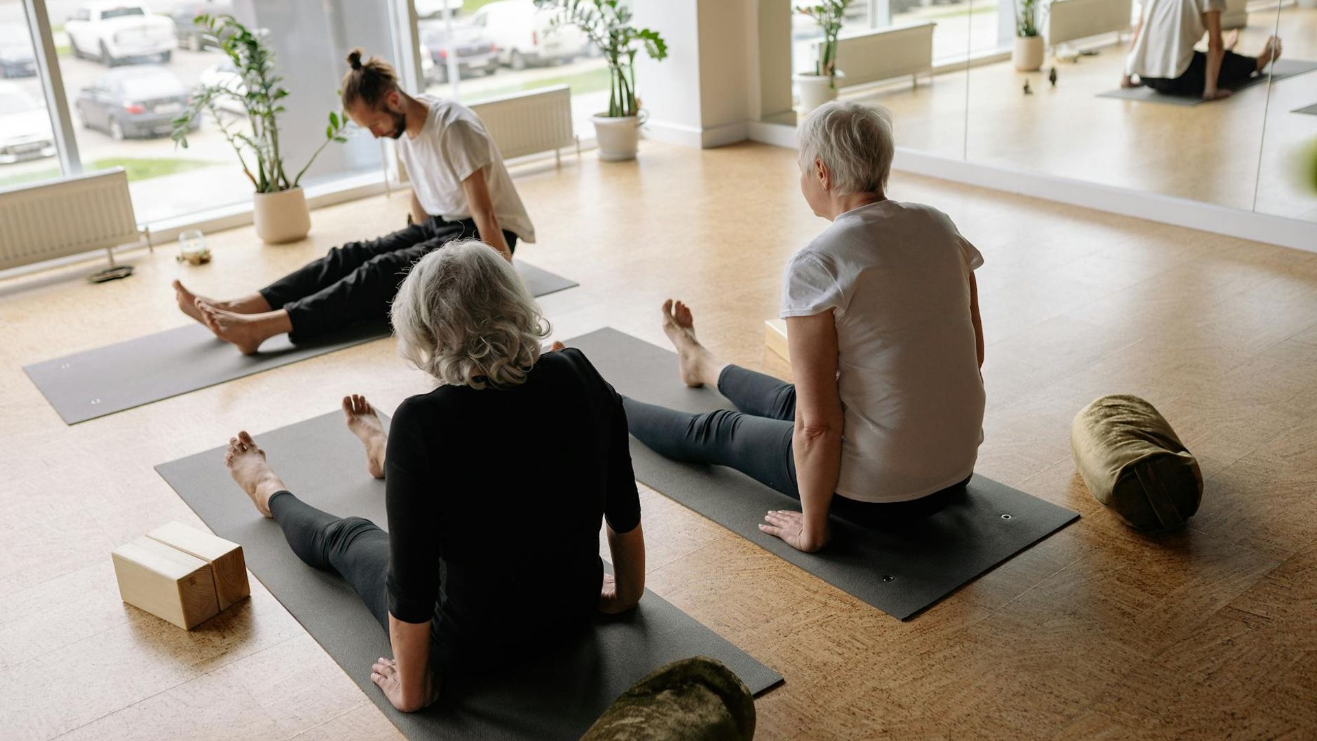 Serene yoga studio atmosphere with soft lighting and carbon texture.